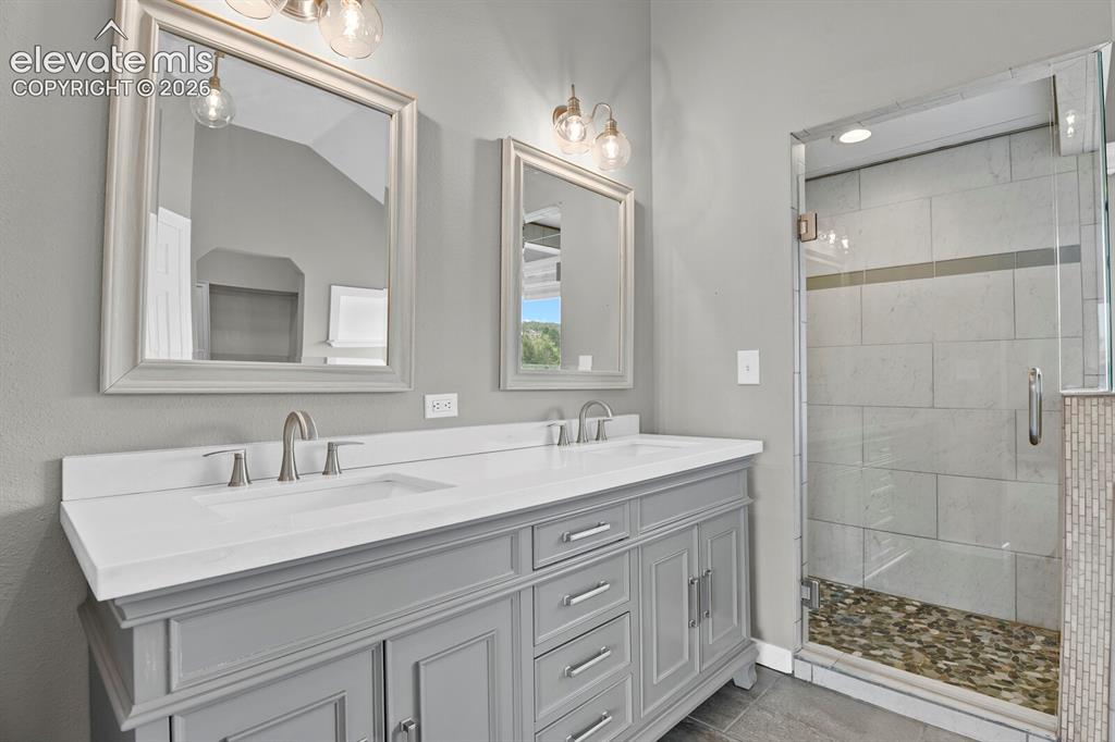 Image 14 of 35: Dual sinks, heated floors,walk-in shower, & separate water closet