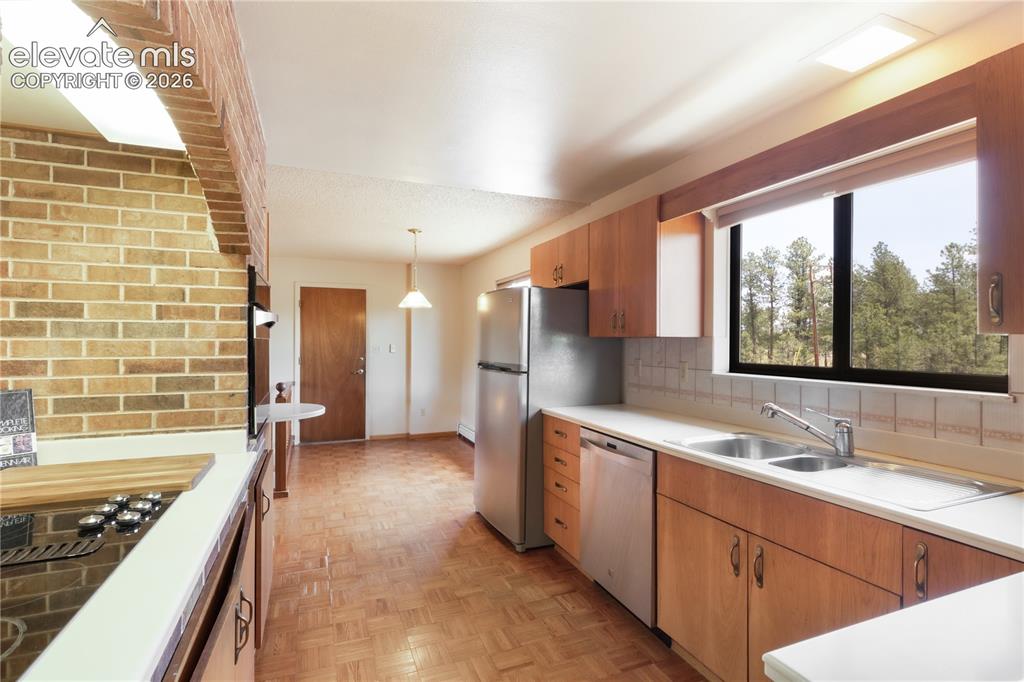 Image 11 of 47: Entryway with coat closet, view into the living room