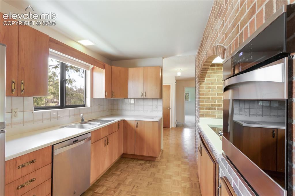 Image 14 of 47: Kitchen with charm, ronson Foodmatic up and brick archway over cooktop