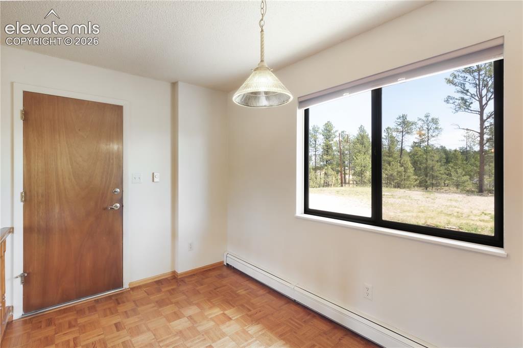 Image 16 of 47: Kitchen and breakfast nook, looking toward the dining area
