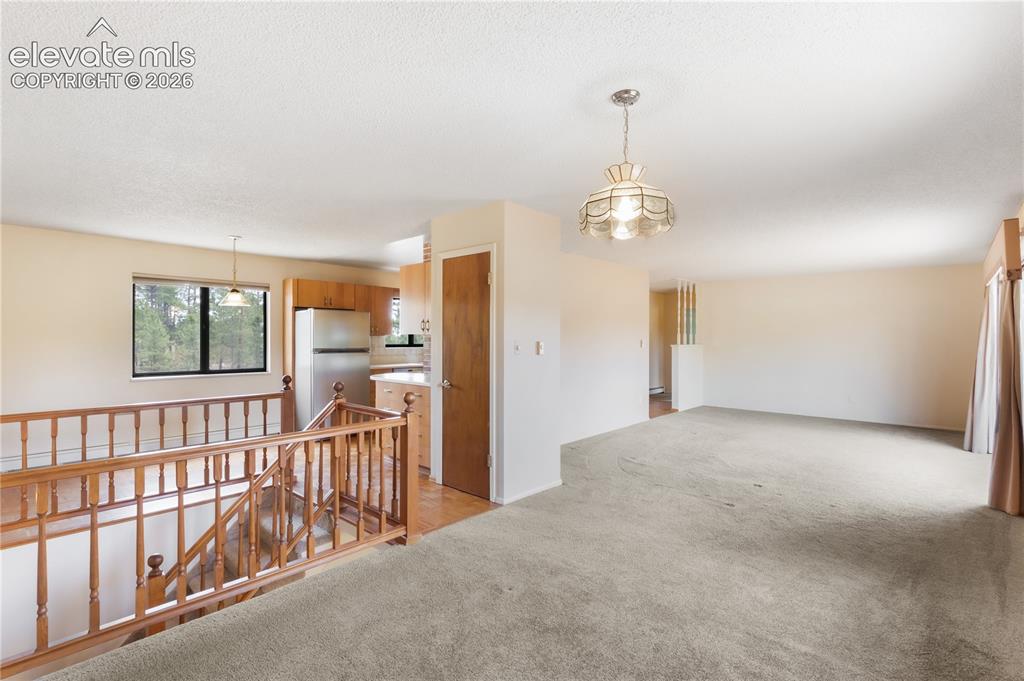 Image 17 of 47: Breakfast nook off kitchen, door to garage on left