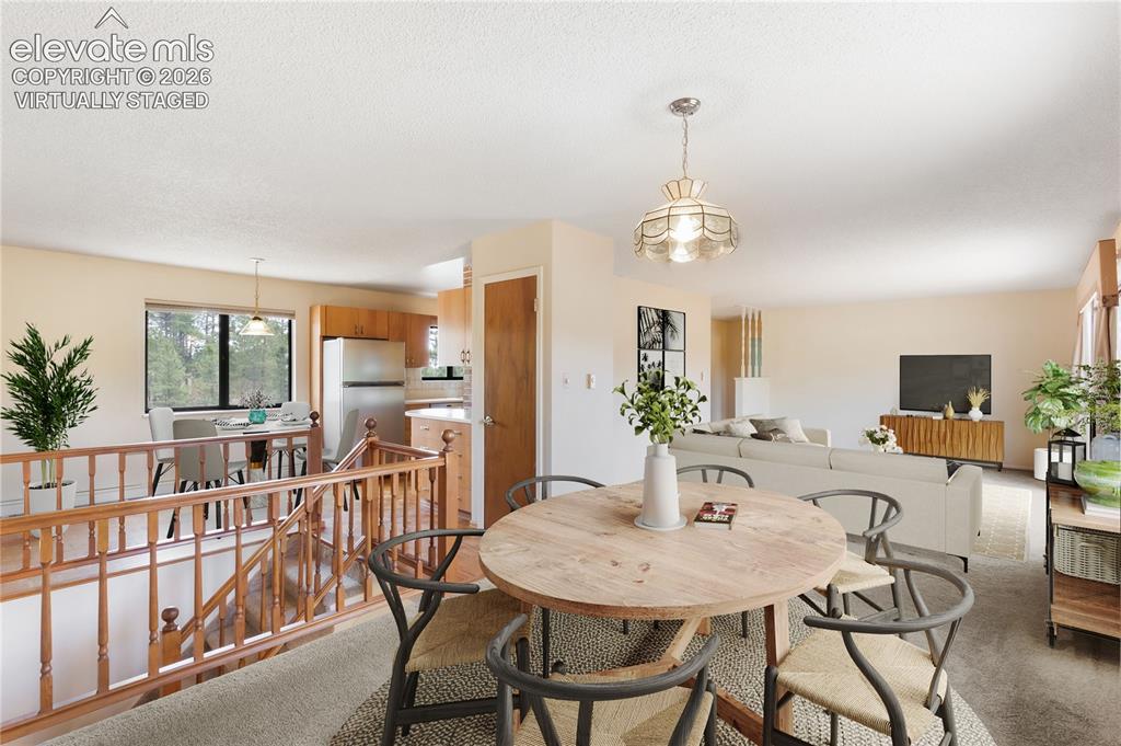 Image 3 of 47: Virtually staged dining and living room