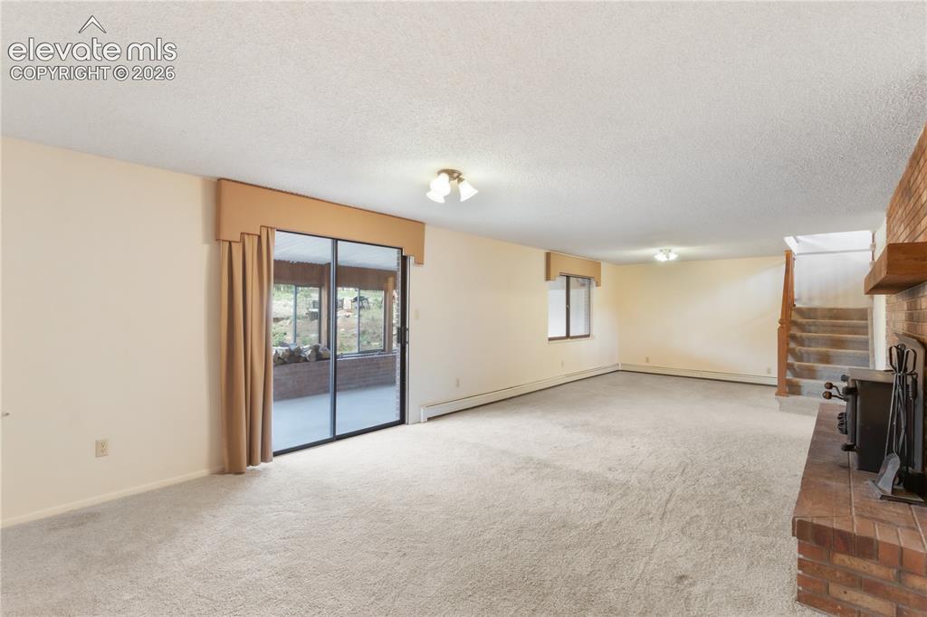 Image 30 of 47: Sunroom off basement family room