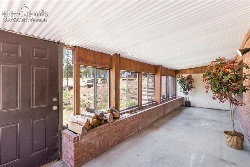 Image 31 of 47: Sunroom off basement family room