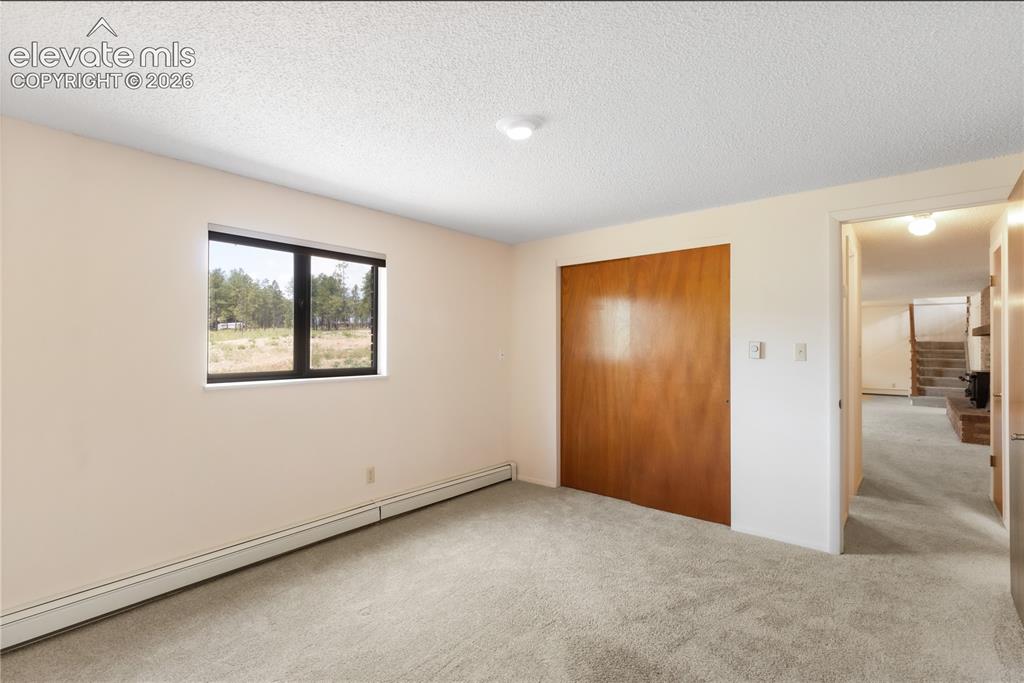 Image 33 of 47: Basement bedroom