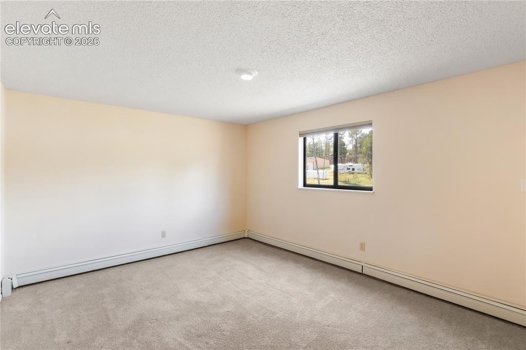 Image 33 of 47: Basement bedroom