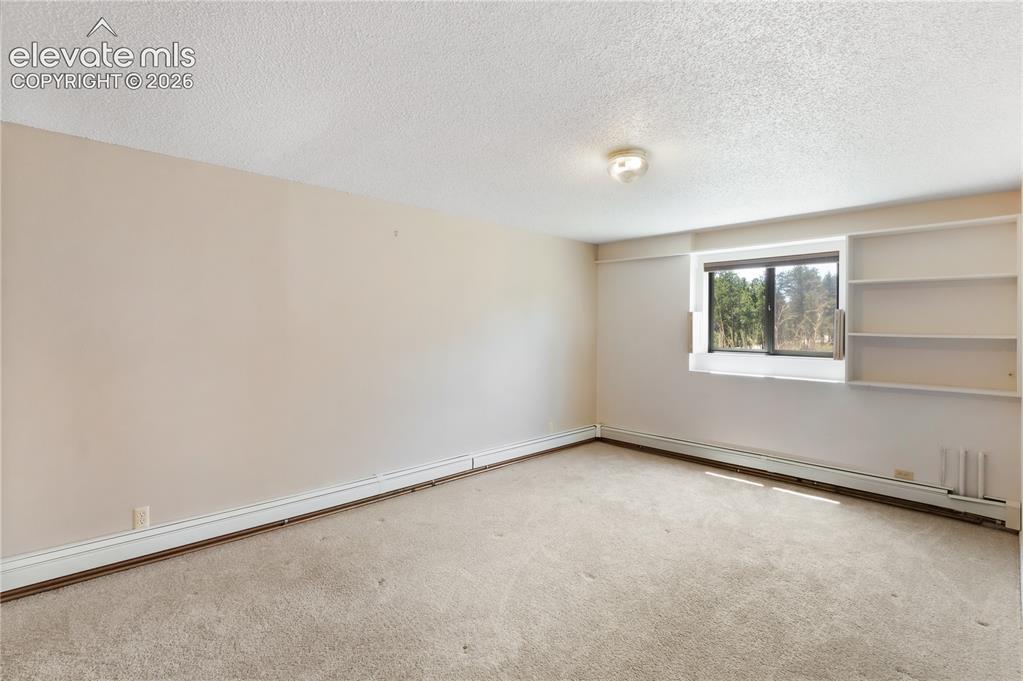 Image 36 of 47: Basement bedroom
