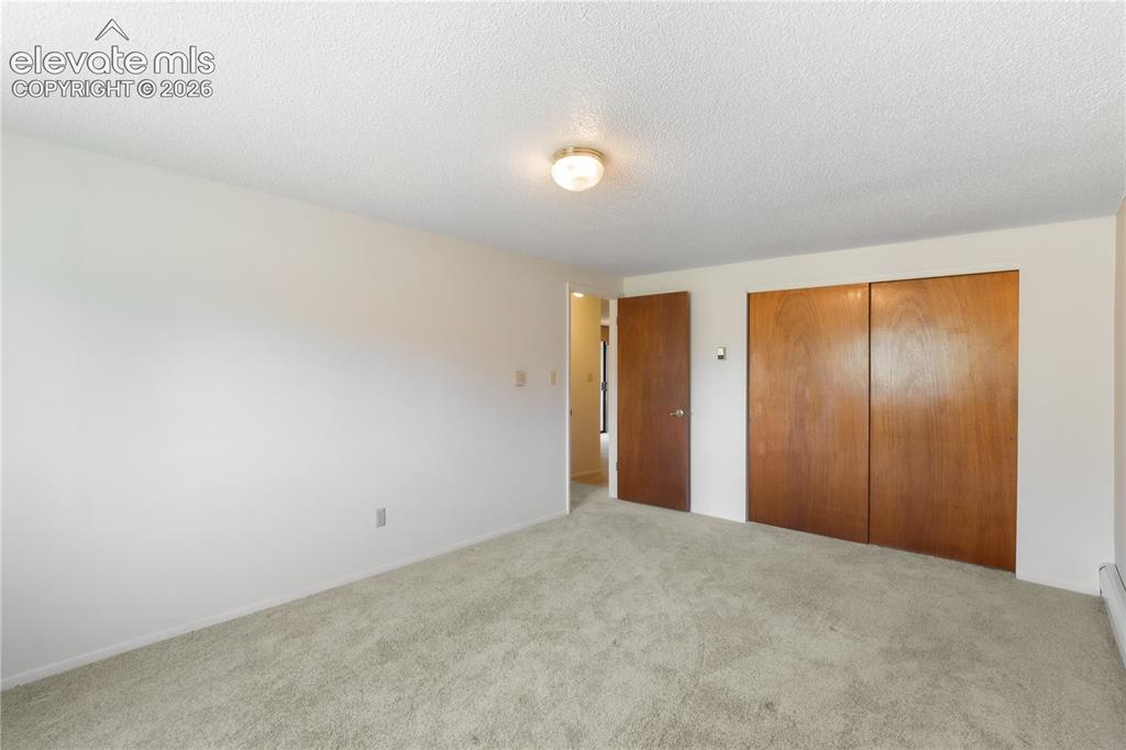 Image 37 of 47: Laundry room in basement with tons of storage