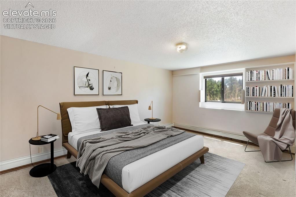 Image 8 of 47: Virtually staged basement bedroom