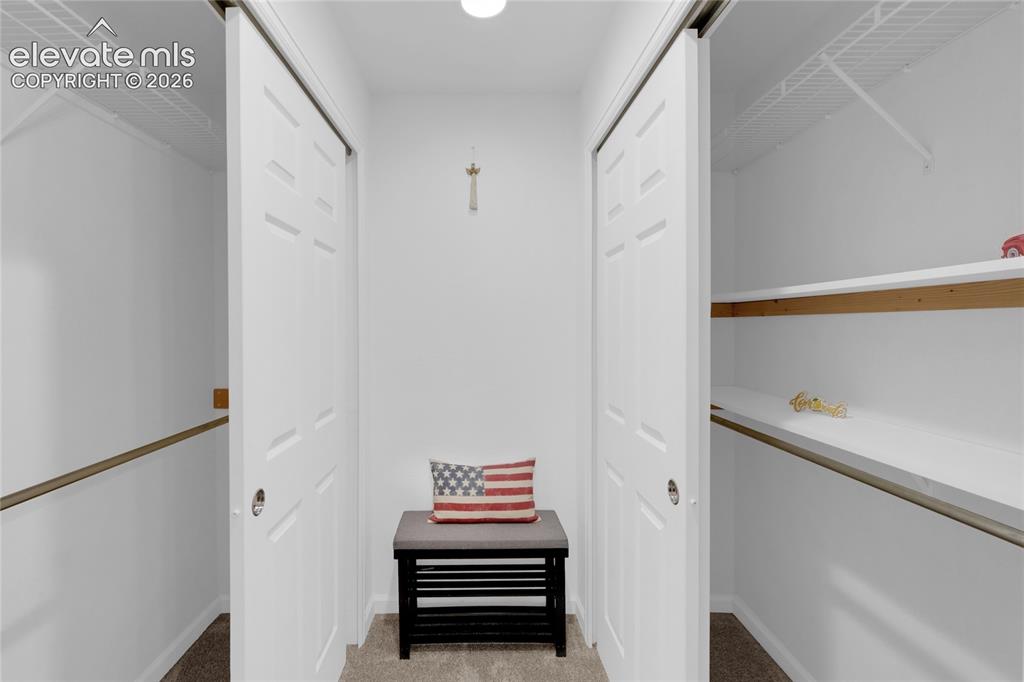 Image 27 of 40: 2nd suite walk-in closet
