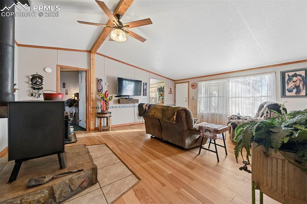 Image 16 of 45: Open layout connecting living space to kitchen and dining areas 