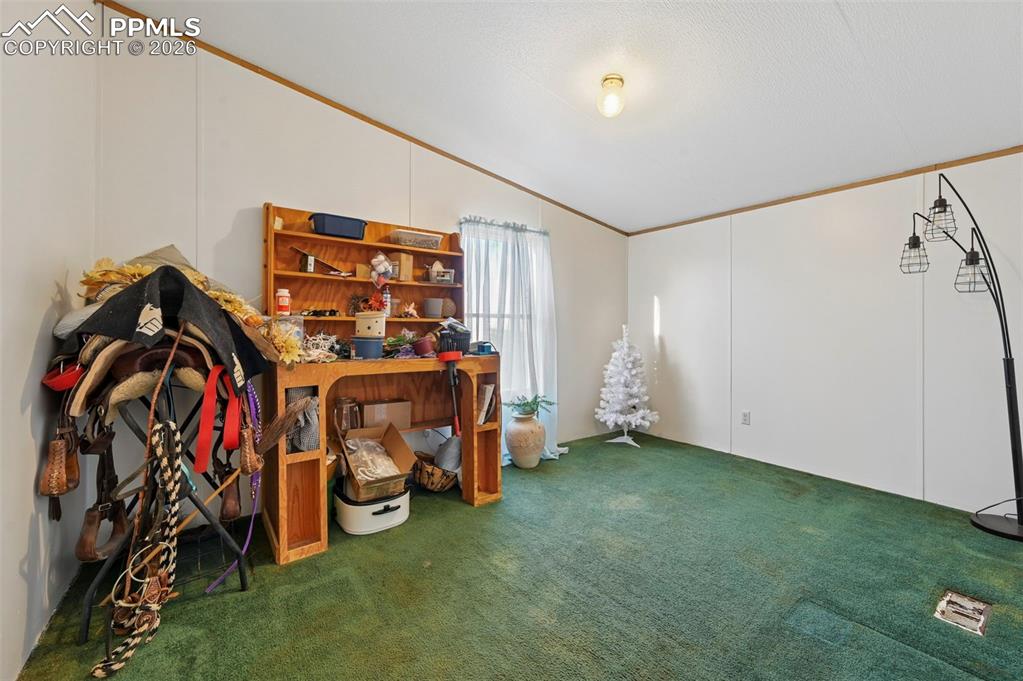 Image 25 of 45:  Secondary bedroom suitable for guests, family, or office use 