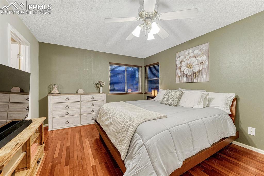 Image 19 of 48: Primary Bedroom w/ Ensuite Bathroom