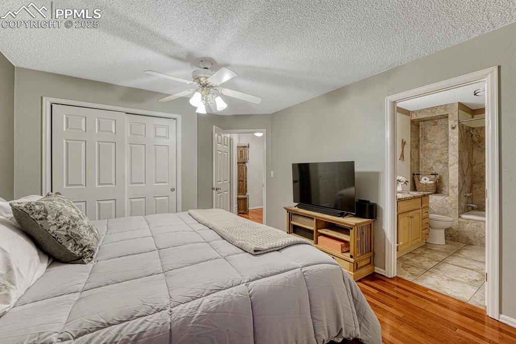 Image 21 of 48: Primary Bedroom w/ Ensuite Bathroom