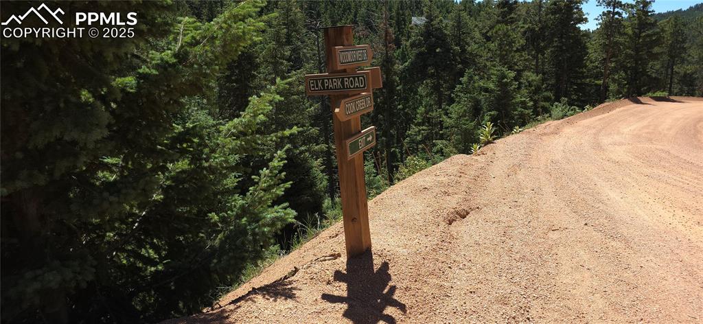 Image 12 of 15: Neighborhood road sign at the base of the property - Elk Park Rd