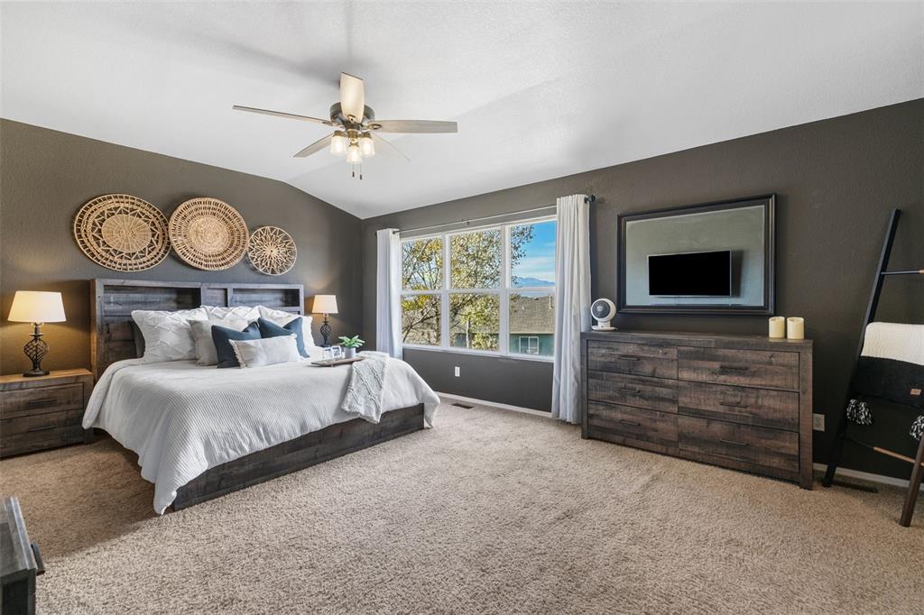 Image 14 of 30: SPACIOUS PRIMARY BEDROOM WITH VIEW OF MOUNTAINS ON UPPER LEVEL