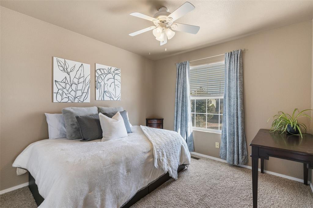Image 18 of 30: 2nd Bedroom with Ceiling Fan on Upper Level