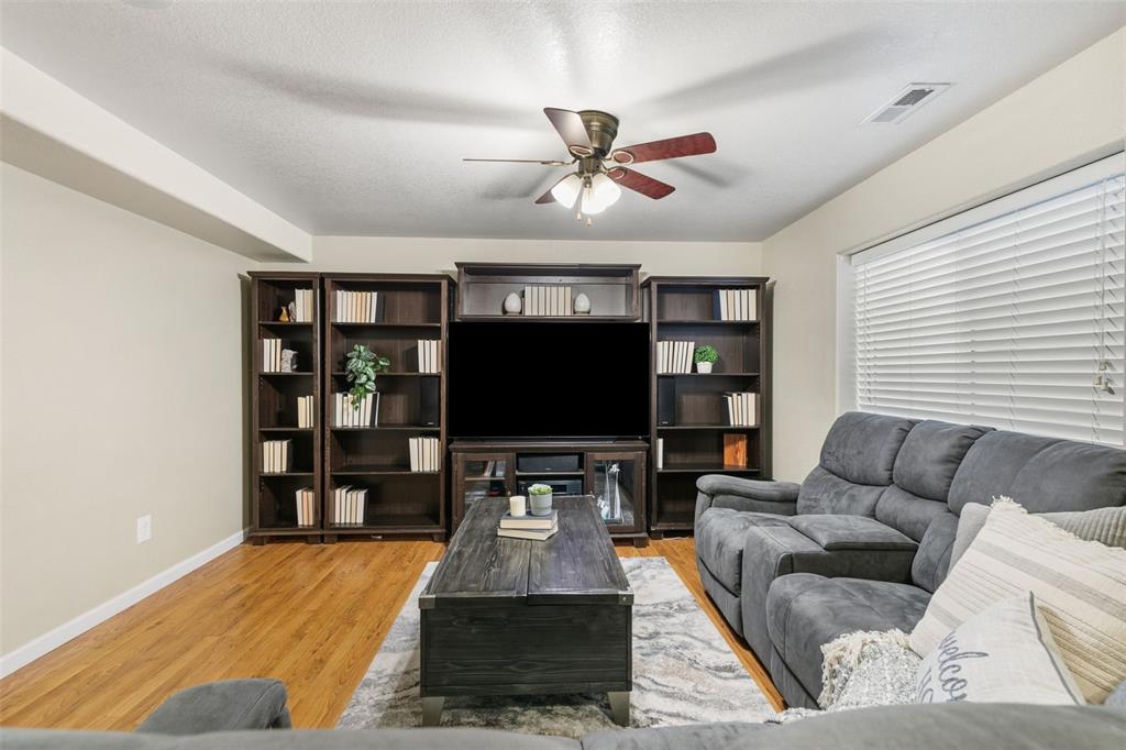 Image 23 of 30: FAMILY ROOM IN BASEMENT WITH CEILING FAN
