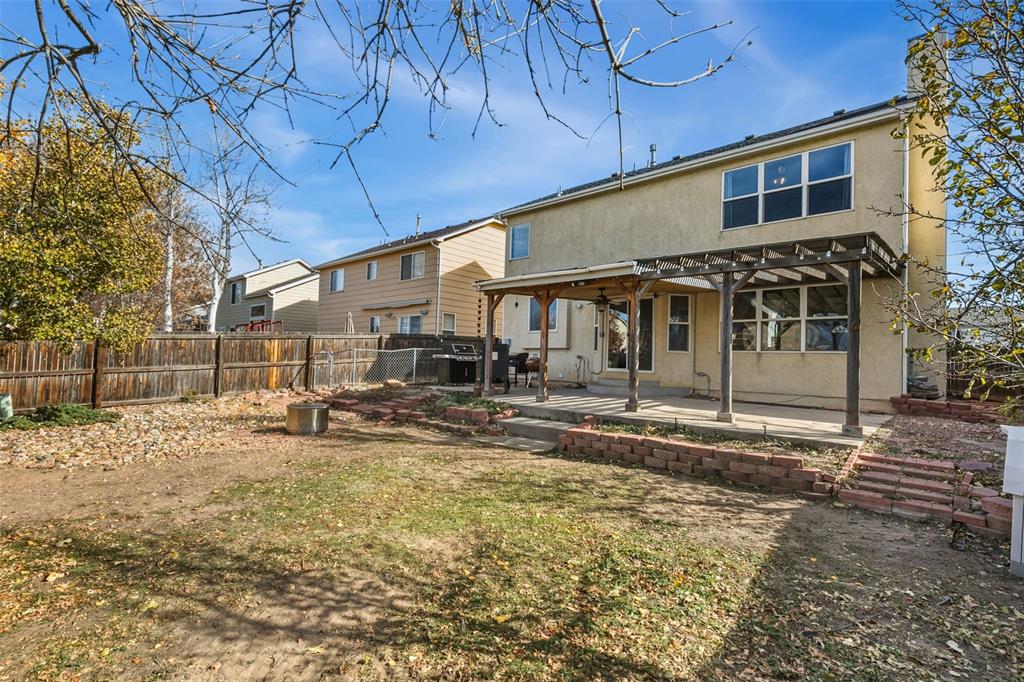 Image 29 of 30: BACK OF HOME WITH FENCED BACKYARD, DOG RUN AND COVERED PATIO & PERGOLA