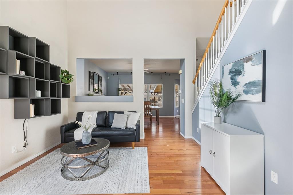 Image 3 of 30: FORMAL LIVING ROOM OPENS TO FAMILY ROOM (CURRENTLY USED AS DINING ROOM) WIT