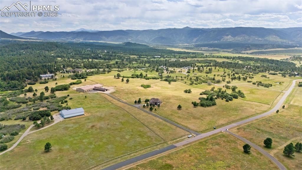 Image 48 of 50: Overview of rural landscape with a mountainous background