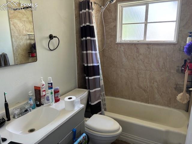 Image 11 of 18: Full bath with vanity and shower / bathtub combination with curtain
