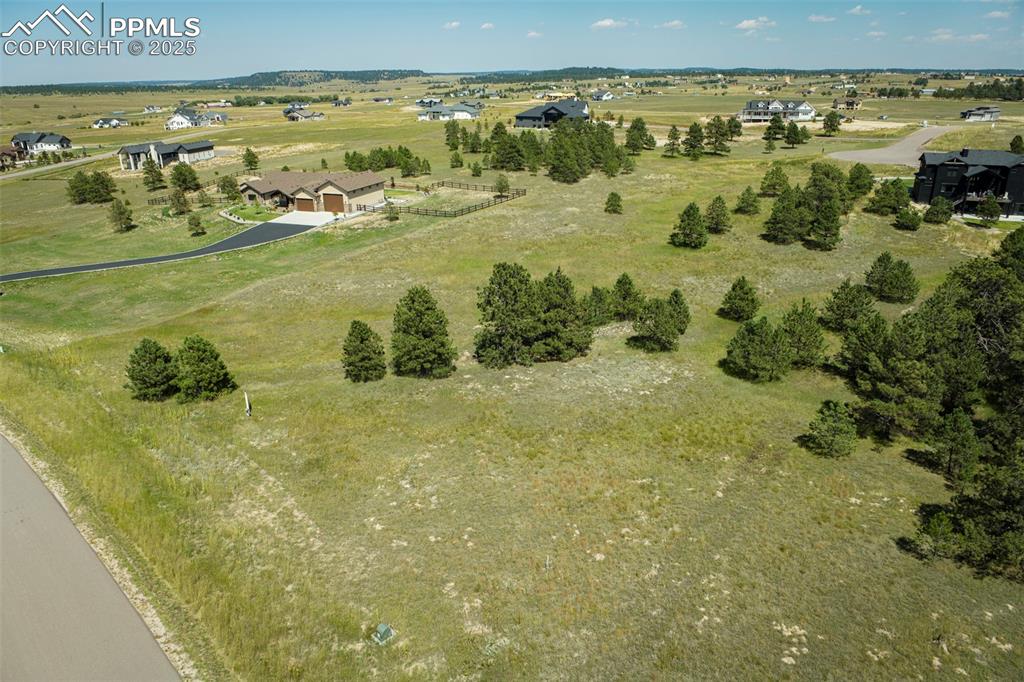 Image 16 of 19: Aerial view of property and surrounding area with rural landscape