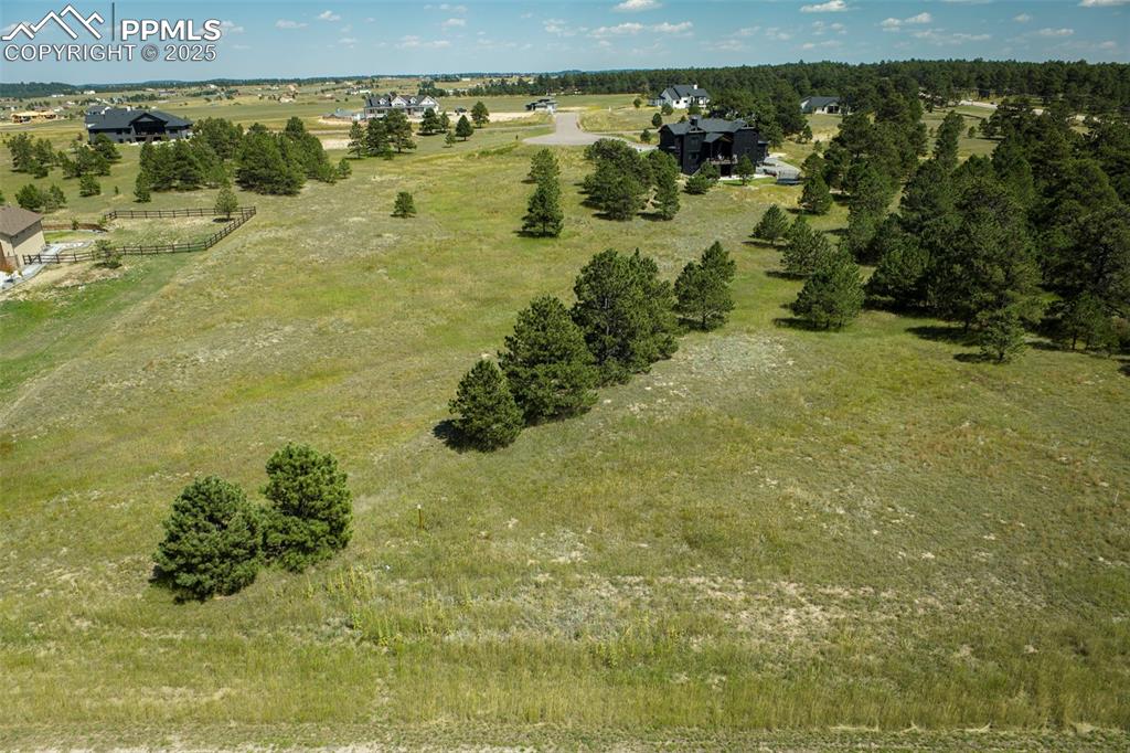 Image 17 of 19: Aerial view of property and surrounding area with rural landscape