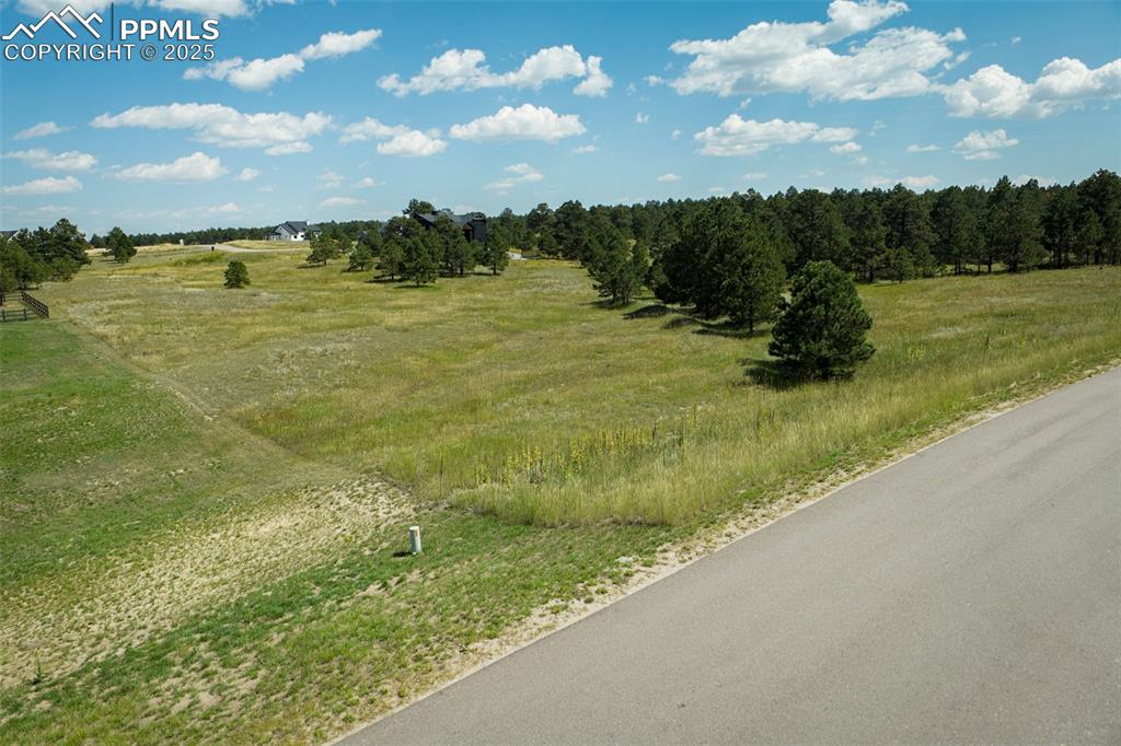 Image 4 of 19: View of asphalt street featuring a view of rural / pastoral area