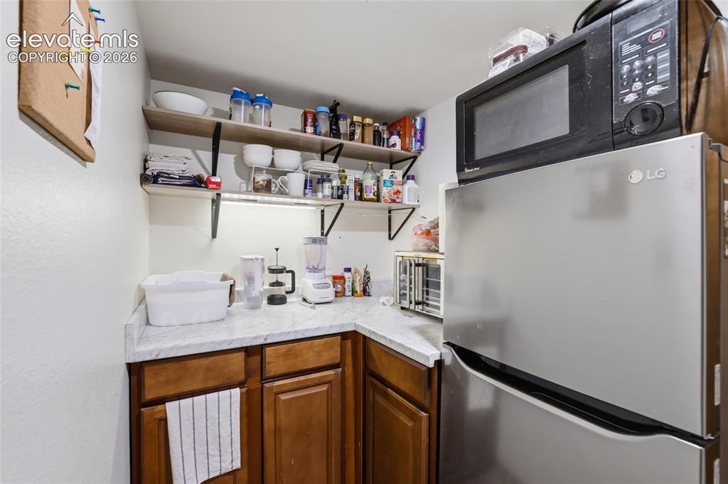 Image 28 of 42: Kitchenette in the basement