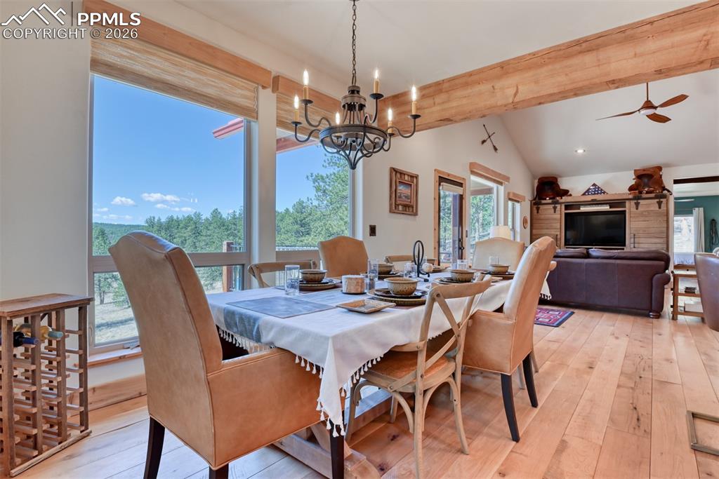 Image 11 of 50: The wood beam in kitchen to living room is Floor joists from the a renovate