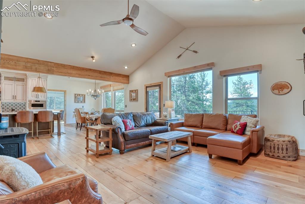 Image 12 of 50: With vaulted ceilings & large windows enjoy the beauty of the area. 