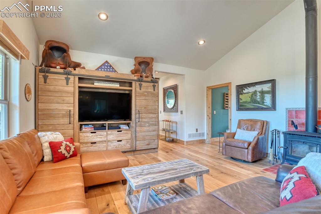 Image 13 of 50: Flooring is a Reclaimed White Oak 7-10 inch planks.. clearly meant to look 