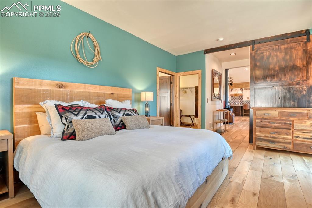 Image 18 of 50: Door on left to the master bathroom suite, door in the middle leads to the 