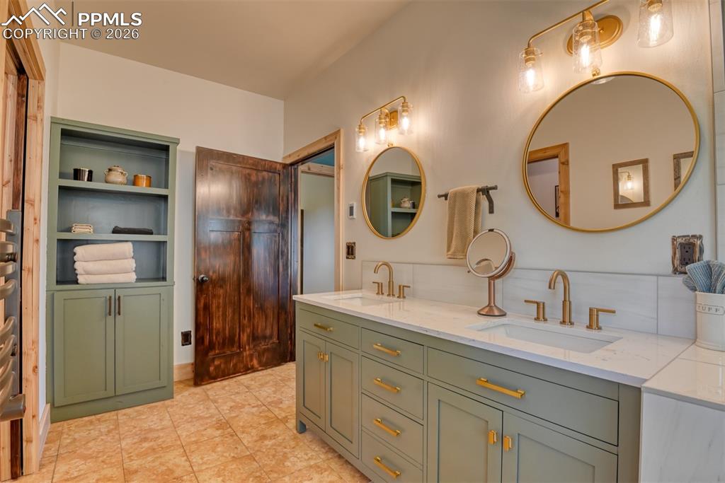 Image 21 of 50: Gorgeous remodeled primary suite is spa-like with radiant heated floors.