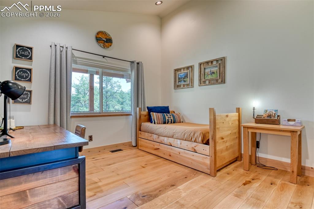 Image 29 of 50: Bedroom #3 is located next to the master bedroom and could serve as a offic