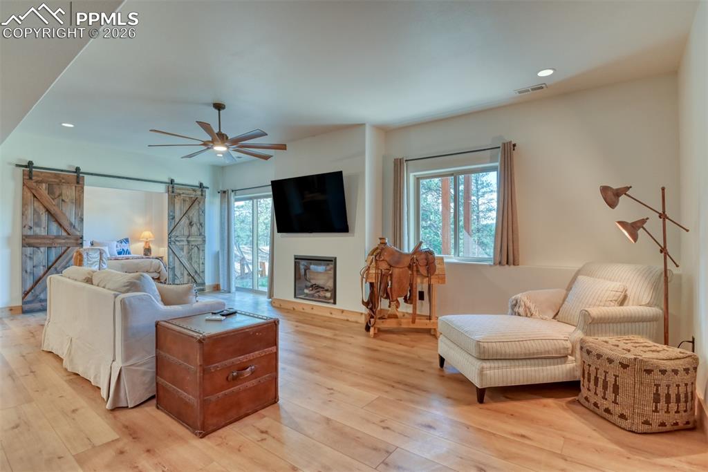 Image 31 of 50: Family room has electric fireplace that can heat the space nicely on a wint