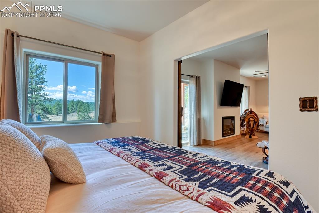 Image 36 of 50: Bonus room in walk out basement is currently used as a bedroom. 