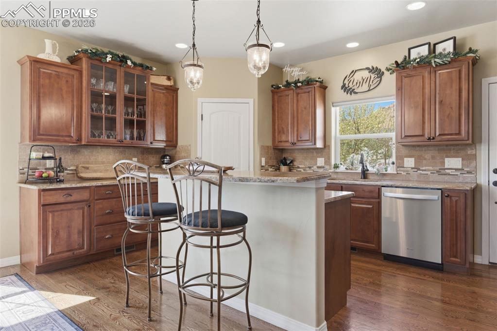 Image 13 of 50: Half bath featuring vanity and dark wood-type flooring