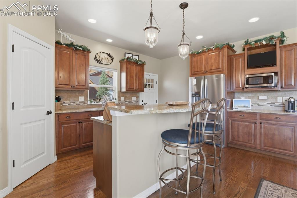 Image 14 of 50: View of patio with a mountain view and a residential view