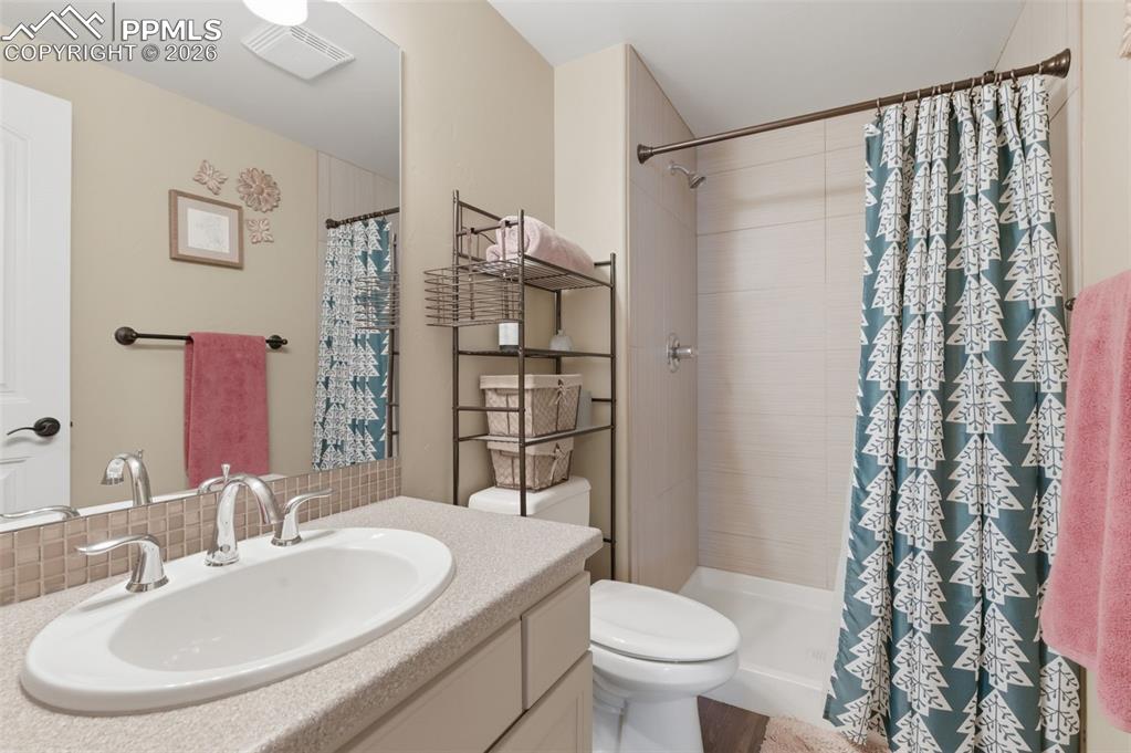 Image 33 of 50: Bedroom featuring light carpet