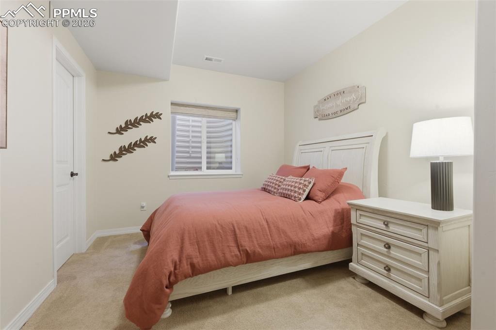 Image 34 of 50: Bathroom featuring vanity, shower / bathtub combination with curtain, and l