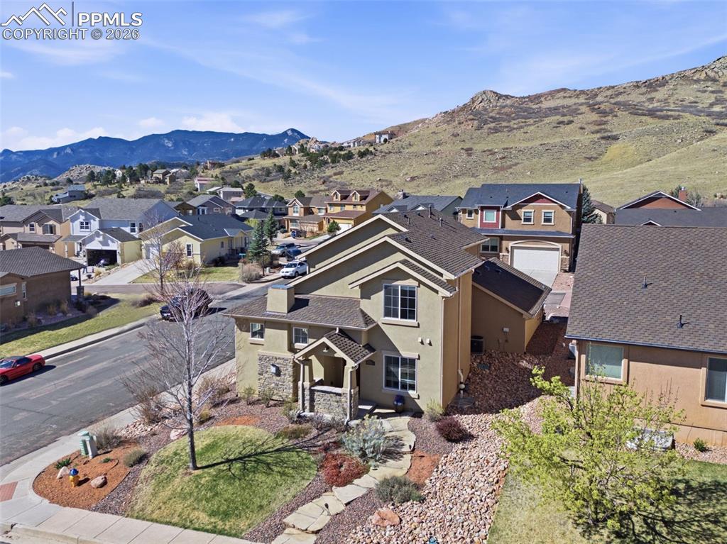 Image 44 of 50: Doorway to property featuring stucco siding and stone siding