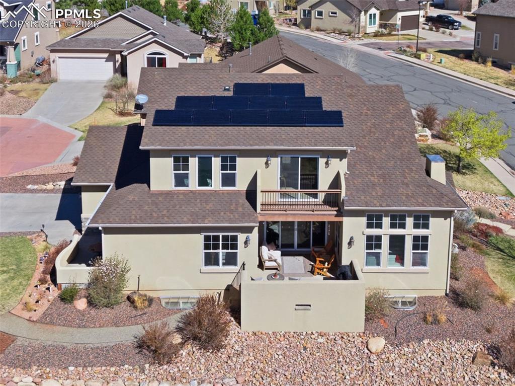 Image 46 of 50: View of side of home with stucco siding