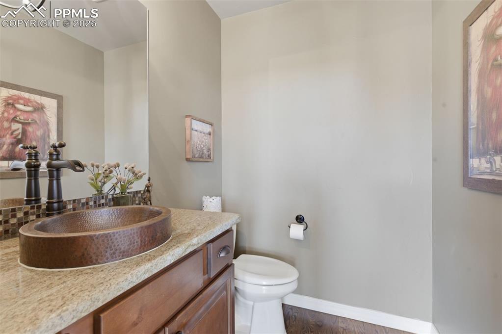 Image 9 of 50: Carpeted living area with a high ceiling and recessed lighting