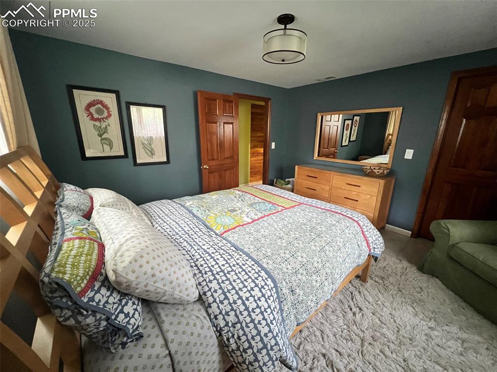 Image 29 of 49: Bedroom featuring carpet and baseboards
