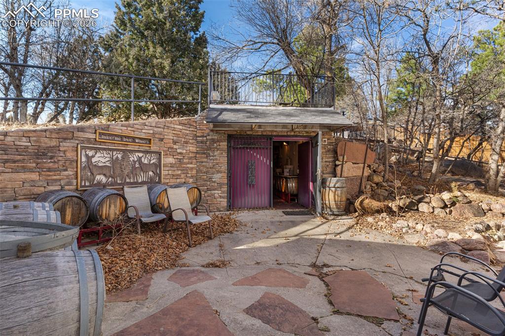 Image 25 of 49: Wine cellar area located in the backyard which was once utilized to both pr