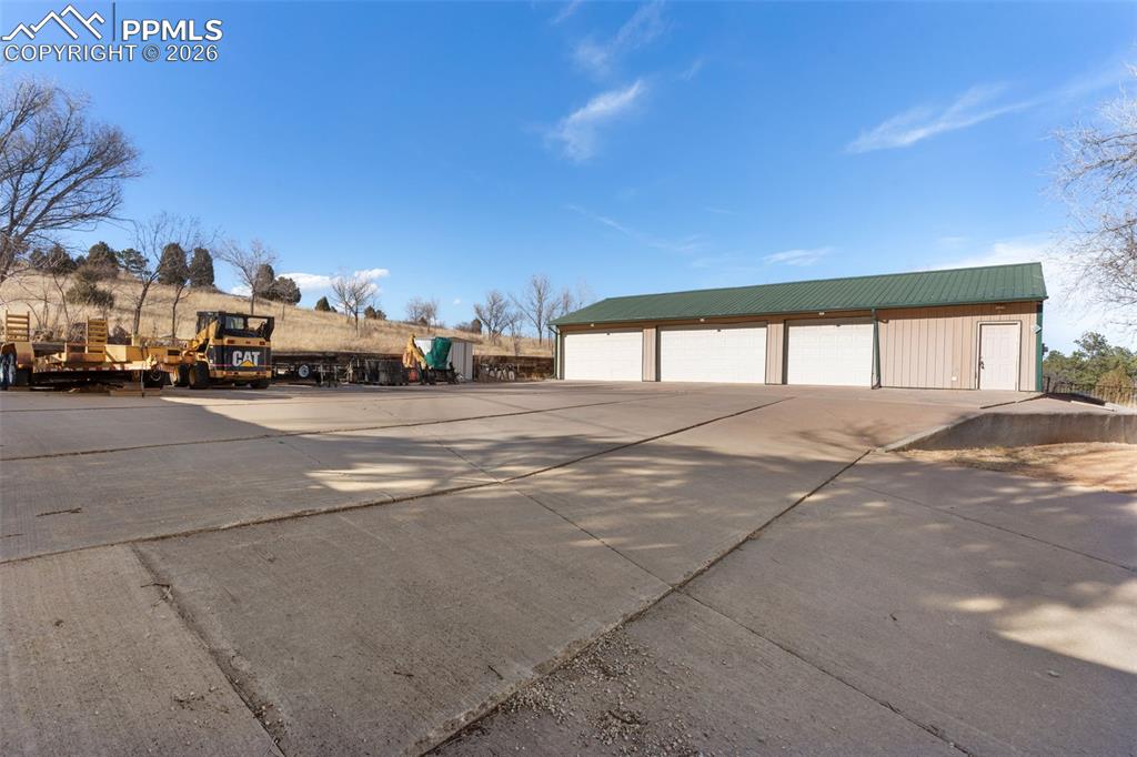 Image 44 of 49: The home features 2 separate detached garages - a 2-car and a 5-car!