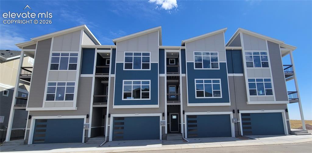 Image 1 of 26: Peak View-End Unit-3 Story-Modern Elevation-2 Car Attached Garage-Several C