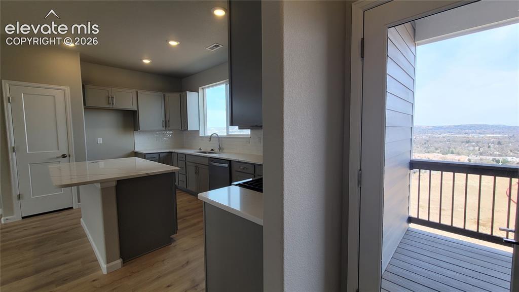 Image 12 of 26: Private covered composite deck off the Kitchen!
